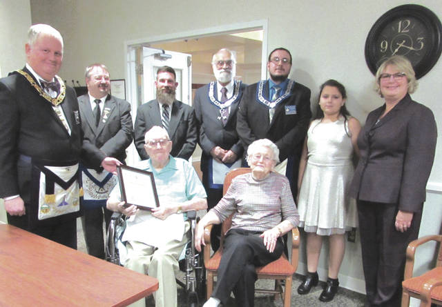 Arcanum Mason Kenneth Stryker receives a 70-year membership pin at a special ceremony