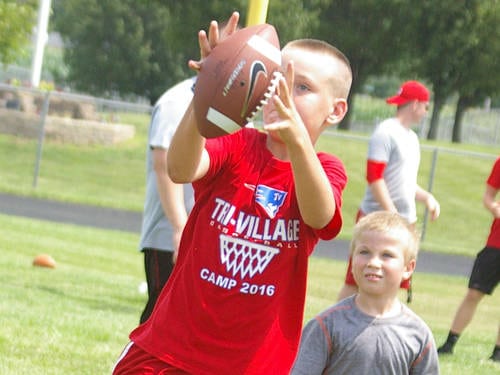Tri-Village’s new football coach Robert Burk leads Patriots’ youth camp