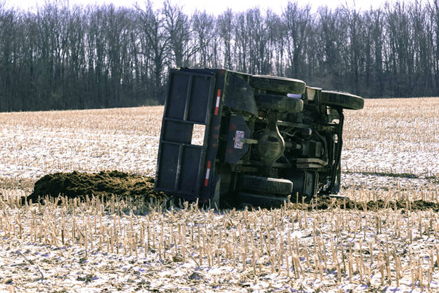 Driver escapes serious injury after rolling dump truck