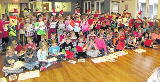 Versailles first graders sing Christmas carols to nursing home residents