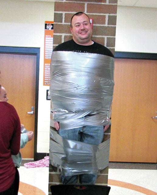 FCCLA raise money by duct taping teacher