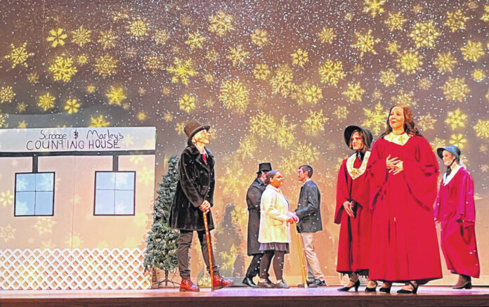 “A Christmas Carol” lights up stage, hearts - The Daily Advocate